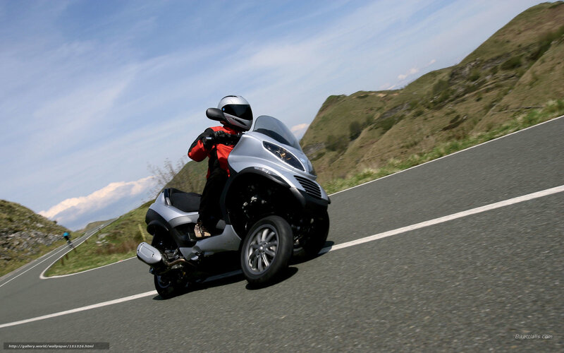 Person on Three-wheeled Scooter — Silver, Dynamic, Afternoon