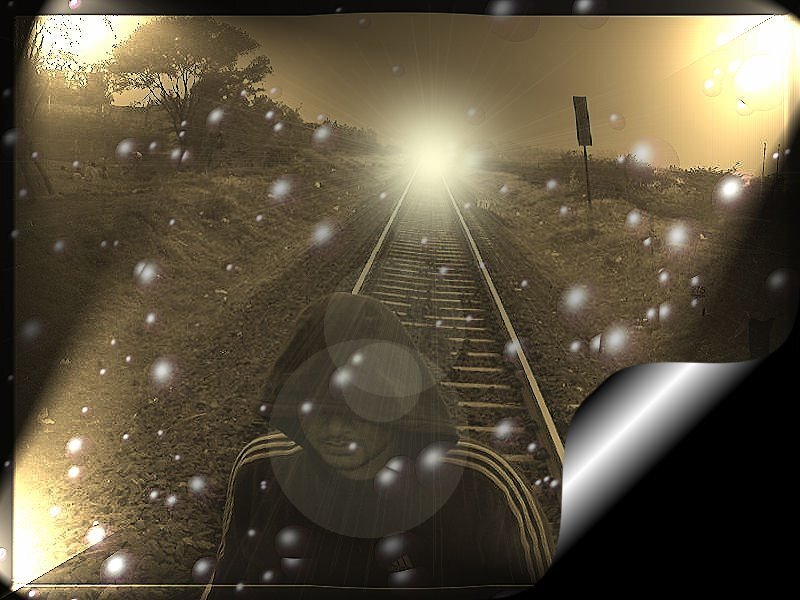 person on train tracks at sunset