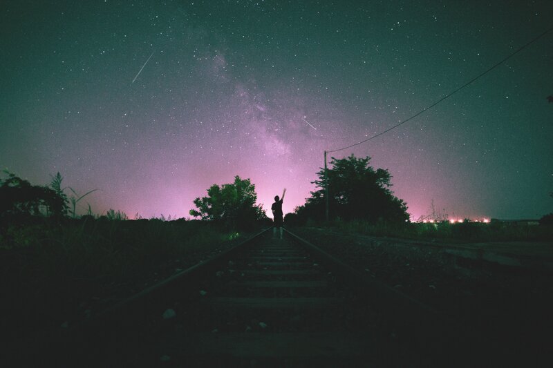 Person on Train Tracks — Purple