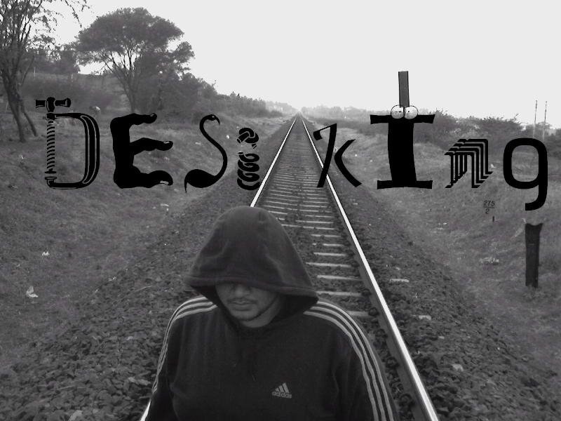 person on train tracks with text