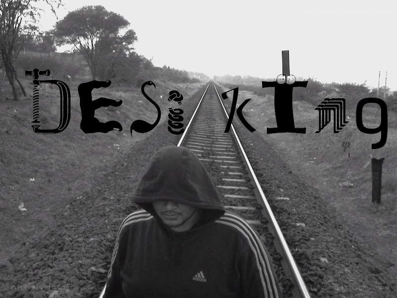 person on train tracks with text