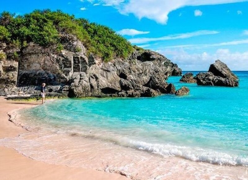 Person on Tropical Beach — Blue, Serene, Afternoon, Photograph, Rocks