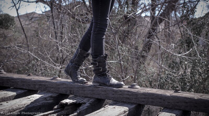 person on wooden beam