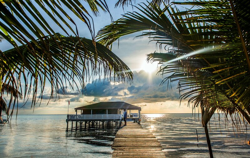 Person on Wooden Dock — Blue, Serene, Sunset