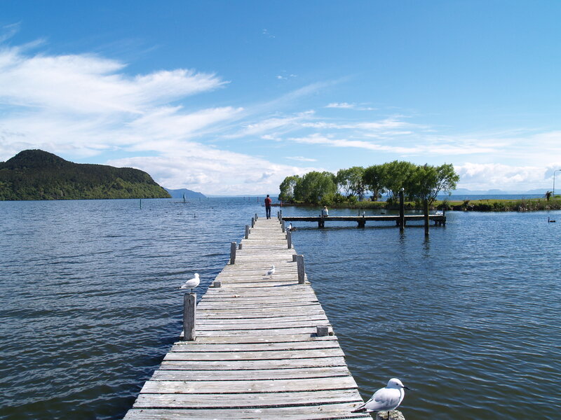 Person on Wooden Pier — Blue