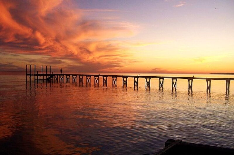 Person on Wooden Pier — Orange, Serene