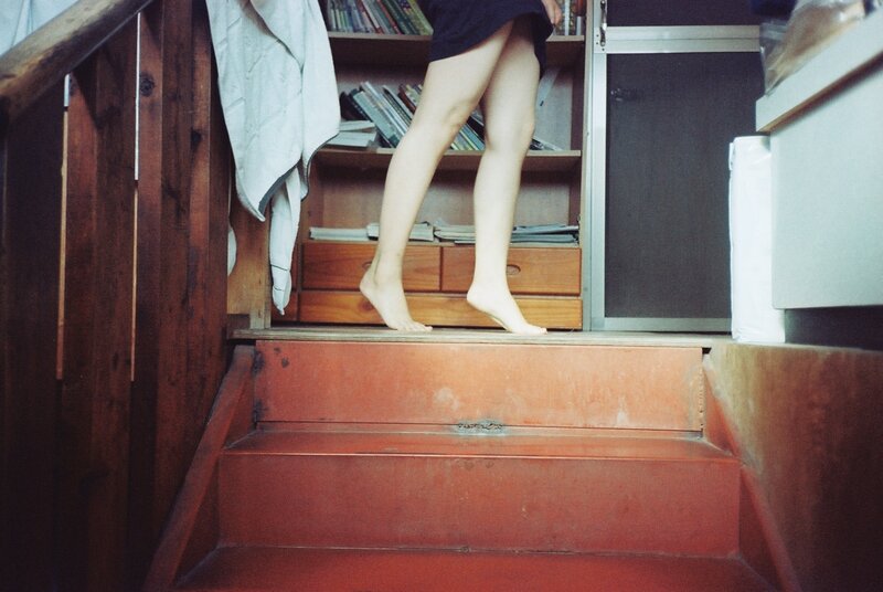 person on wooden stairs