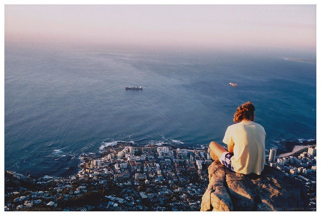 Person overlooking city and sea
