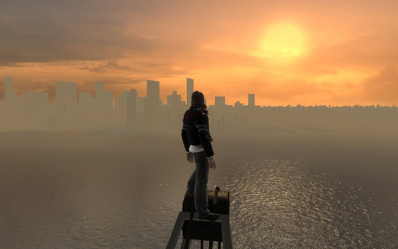 person overlooking city at sunset