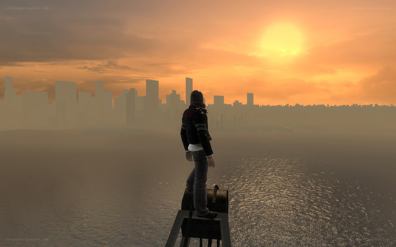 person overlooking city at sunset