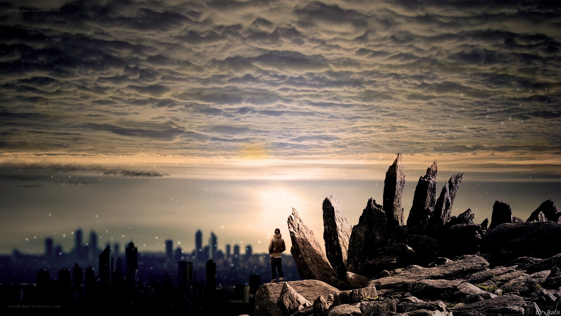 Person overlooking city at sunset