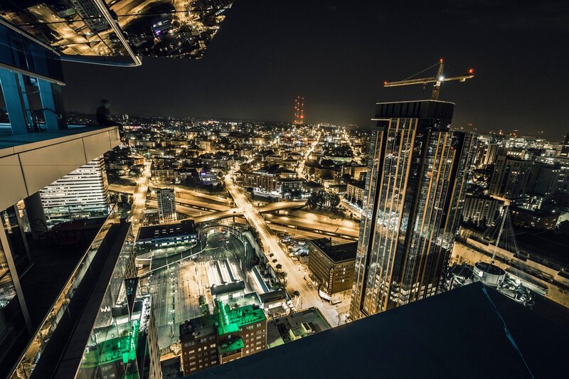 Person Overlooking City — Black