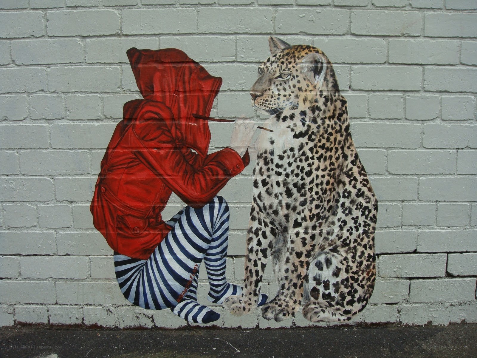 person painting a leopard