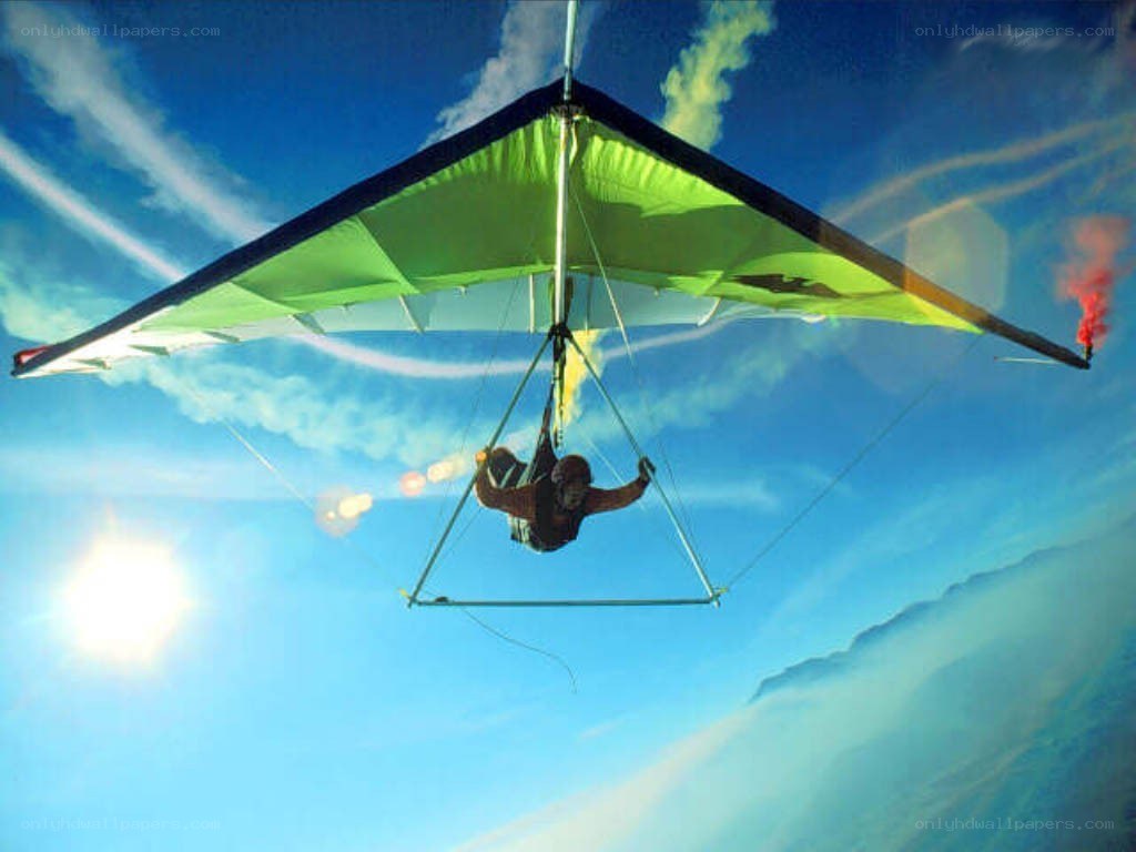 Person paragliding in the sky