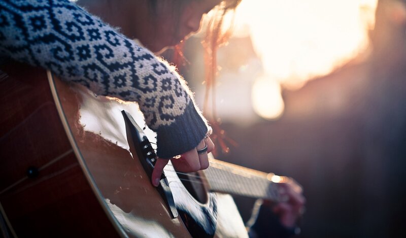 Person Playing Acoustic Guitar — Brown, Serene