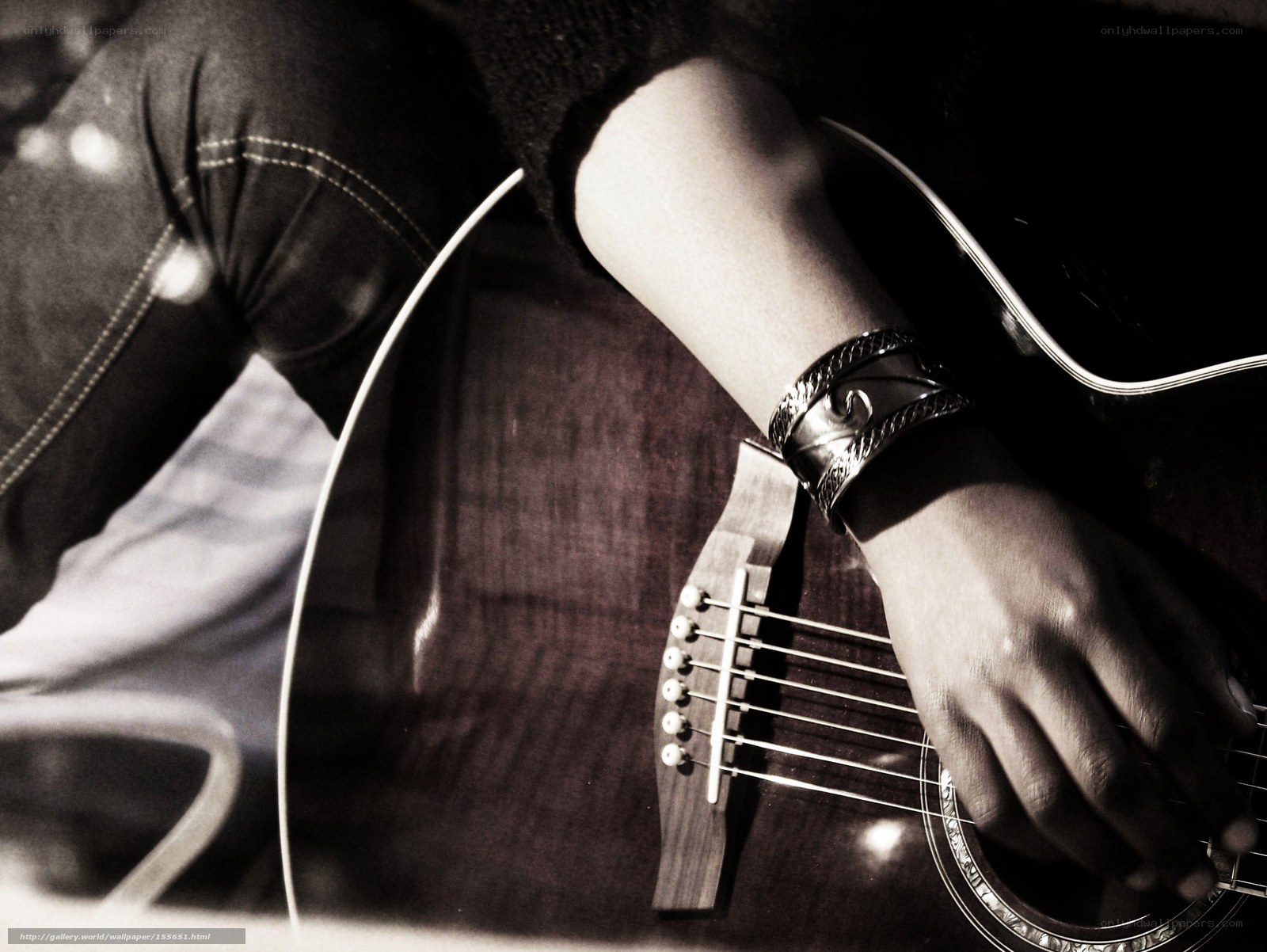person playing acoustic guitar