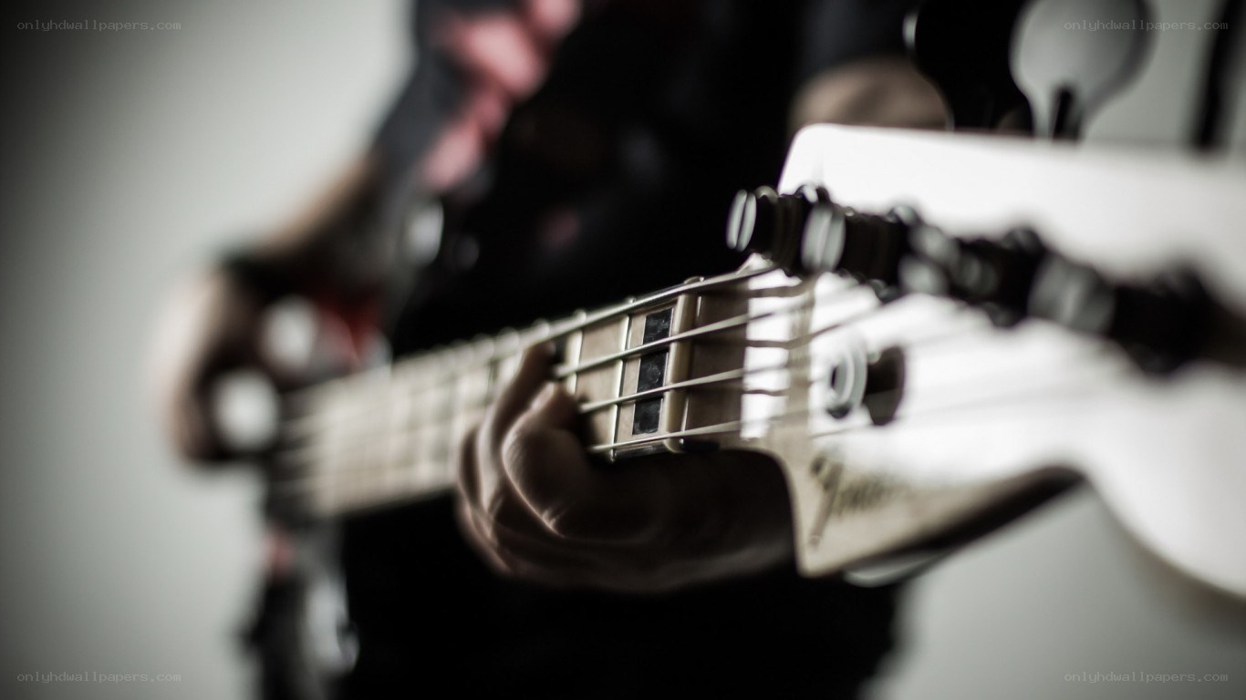 person playing bass guitar