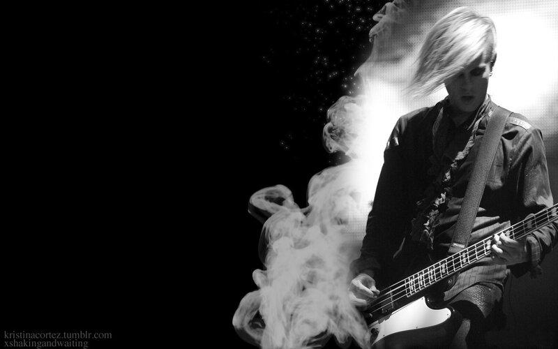 Person Playing Bass Guitar — Black