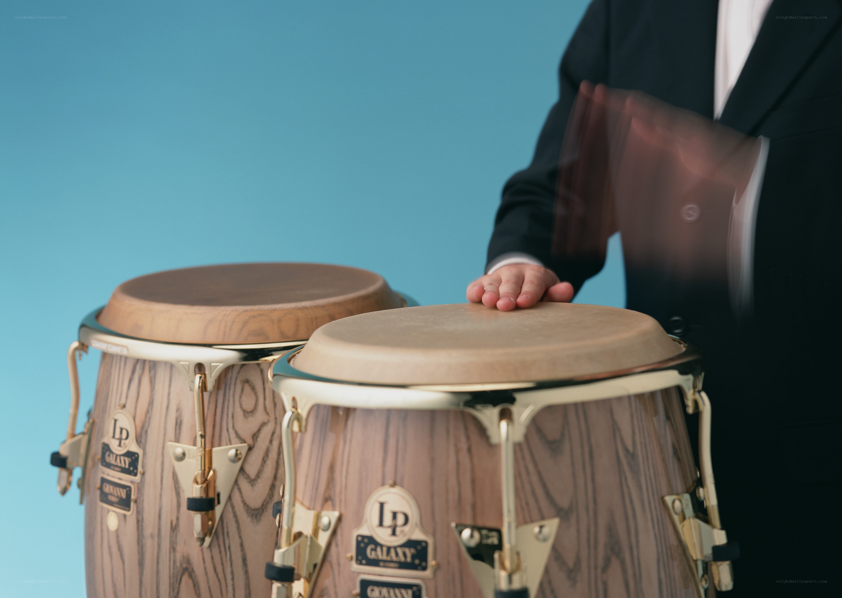 Person playing conga drums