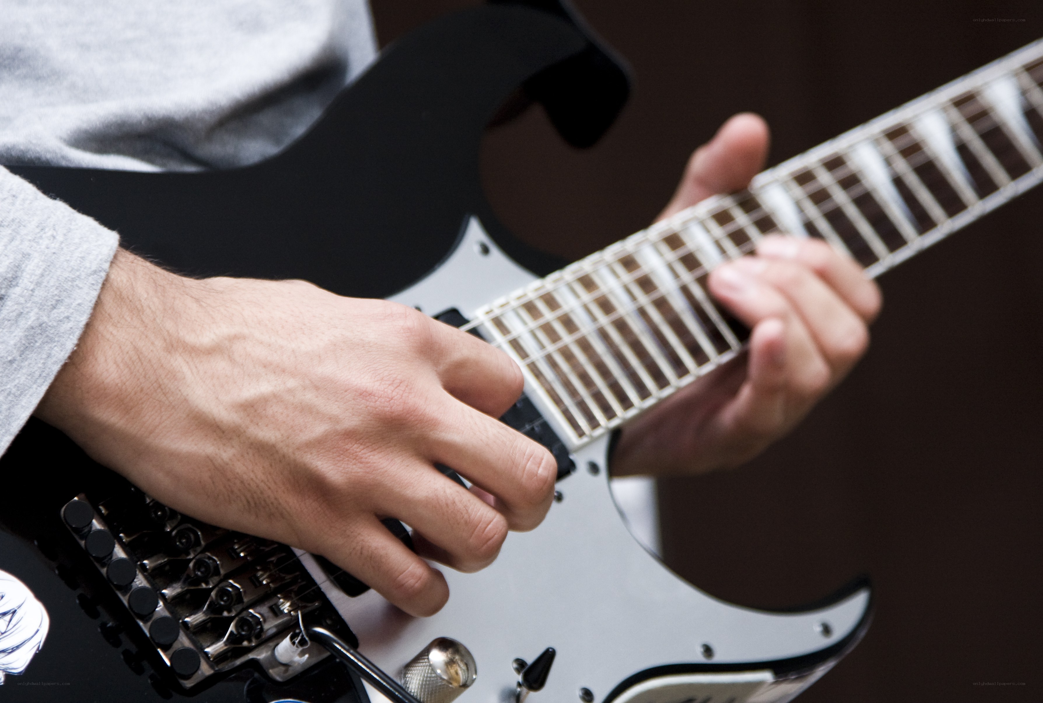 person playing electric guitar