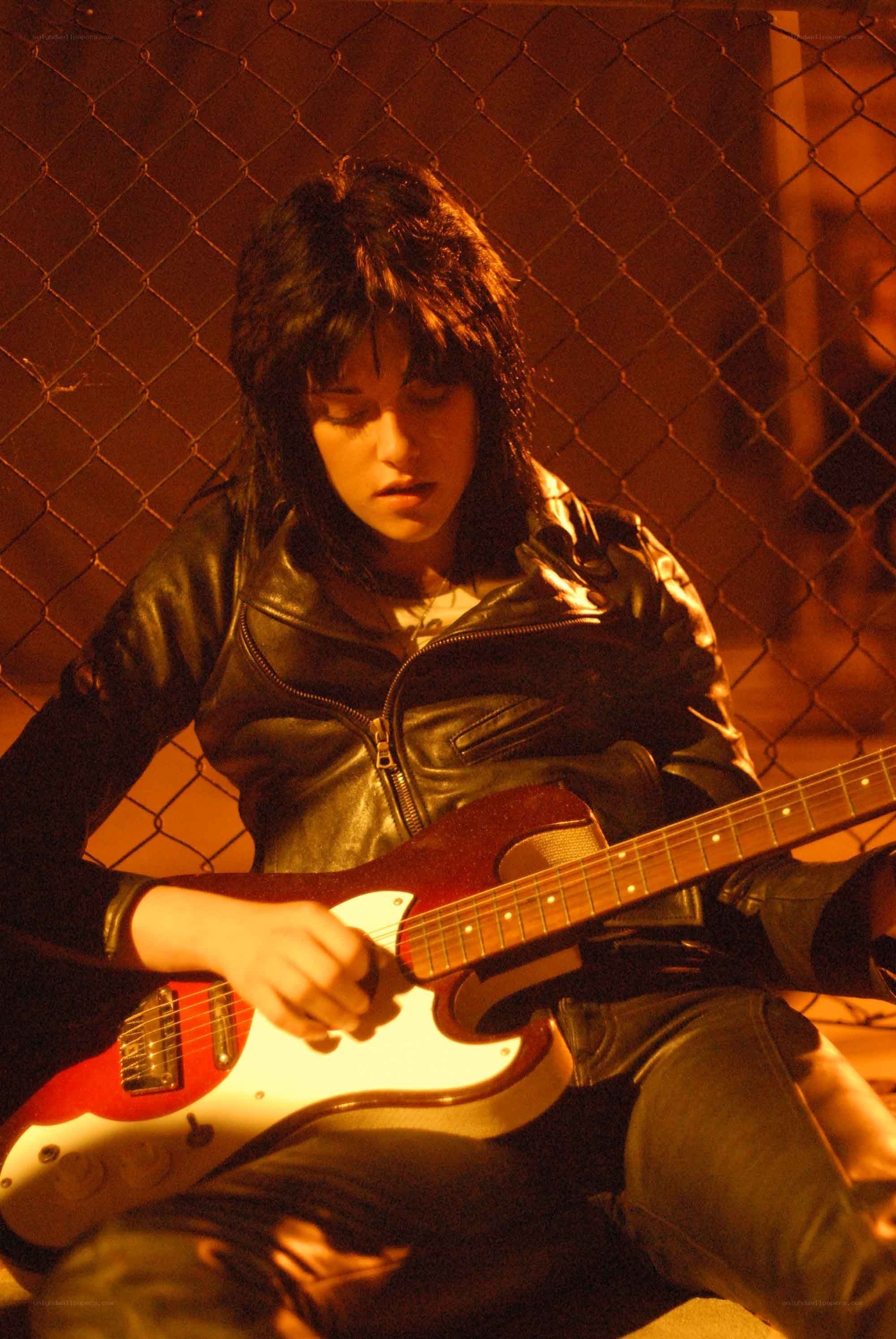 person playing electric guitar
