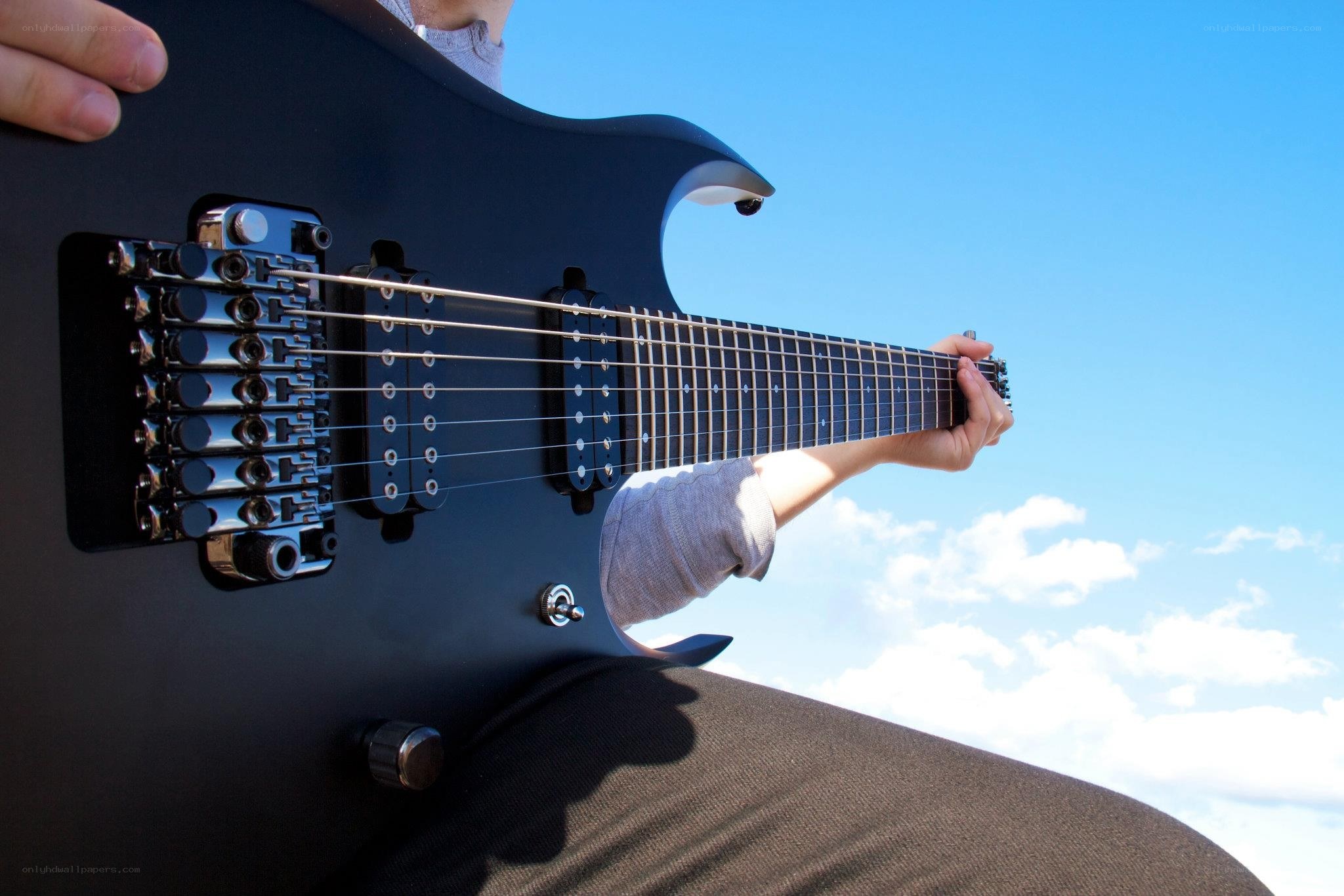 person playing electric guitar