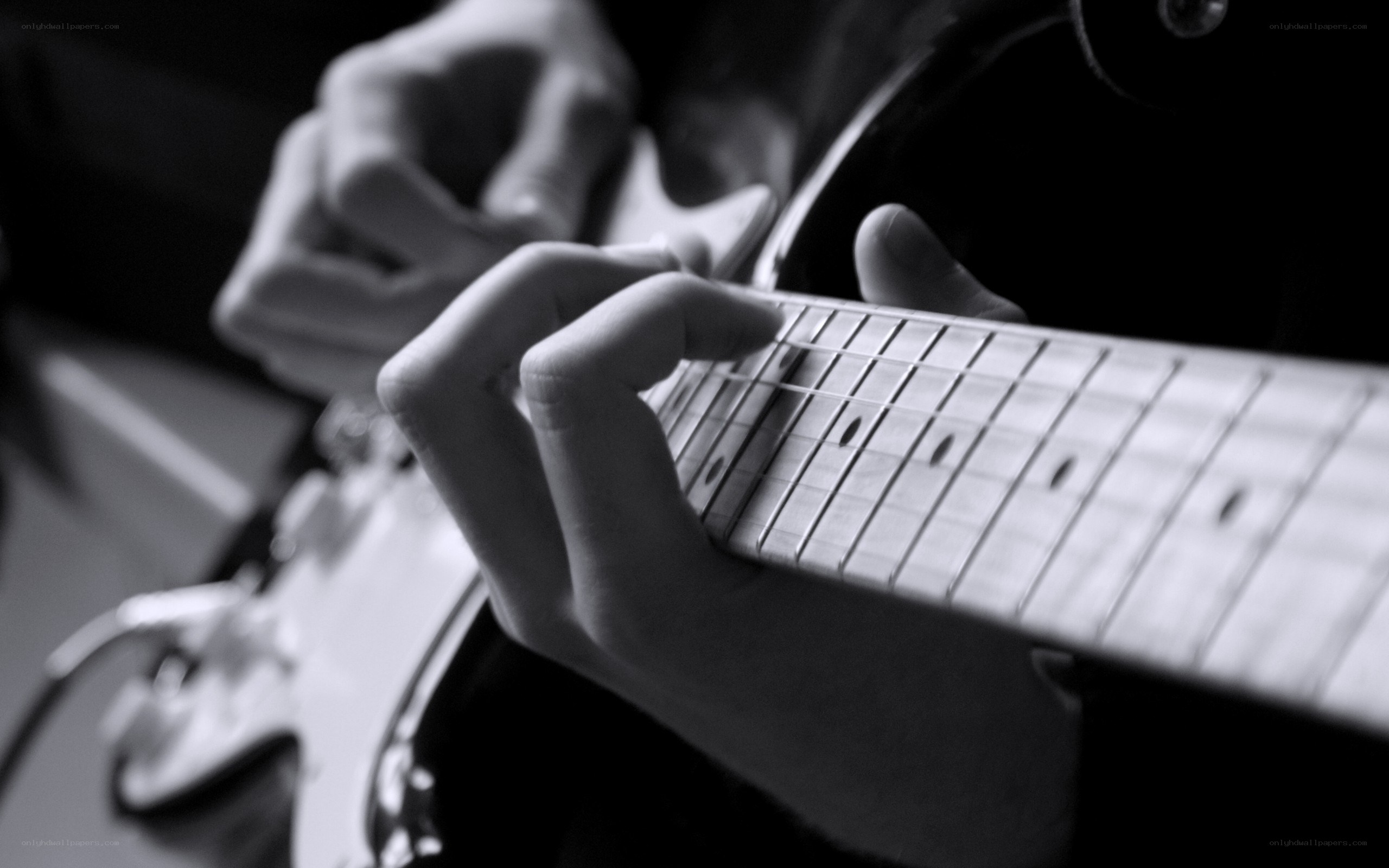person playing electric guitar