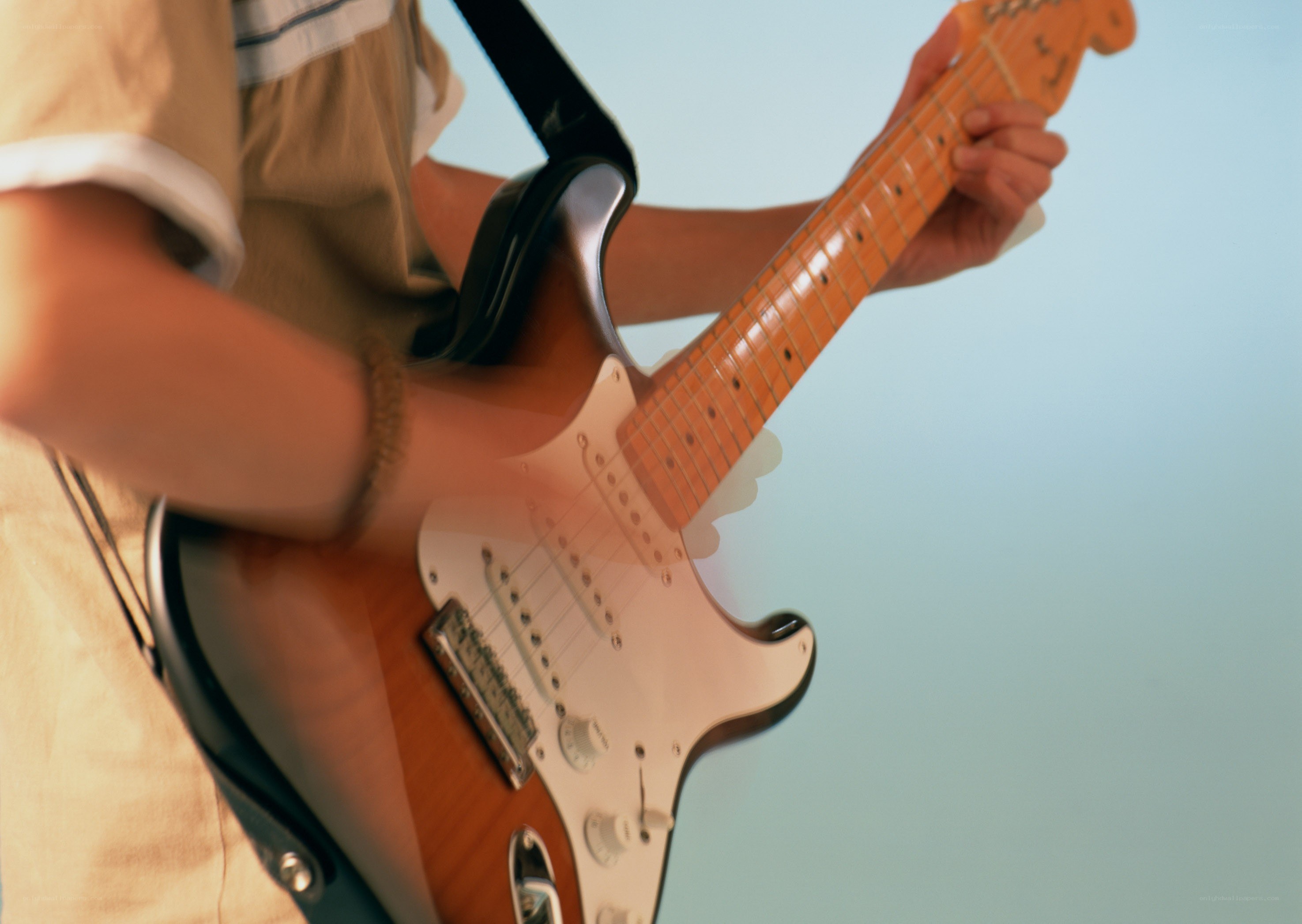 person playing electric guitar