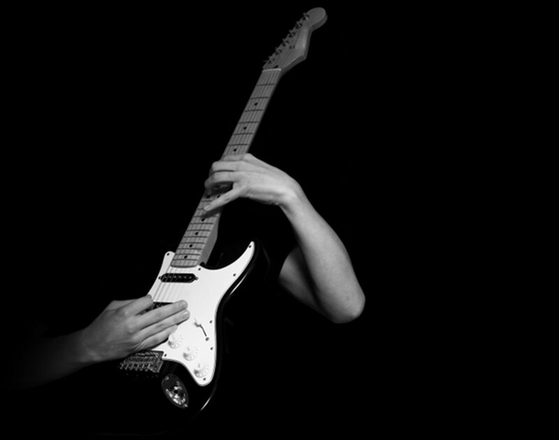 Person Playing Electric Guitar — Black, Dramatic, Photograph