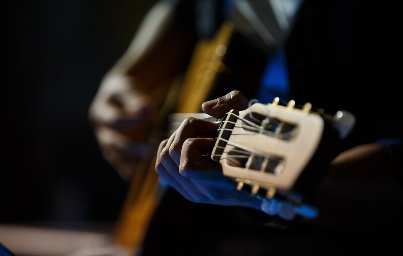 Person Playing Guitar — Black, Dramatic, Night, Photograph