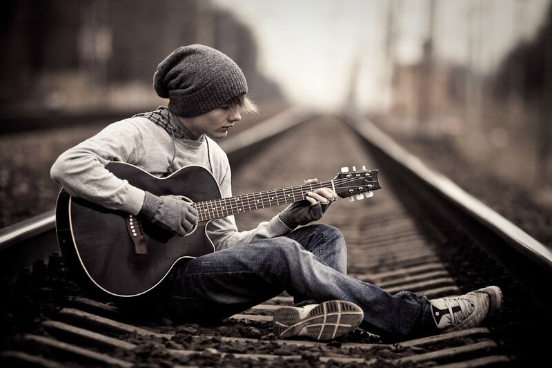 Person Playing Guitar — Gray