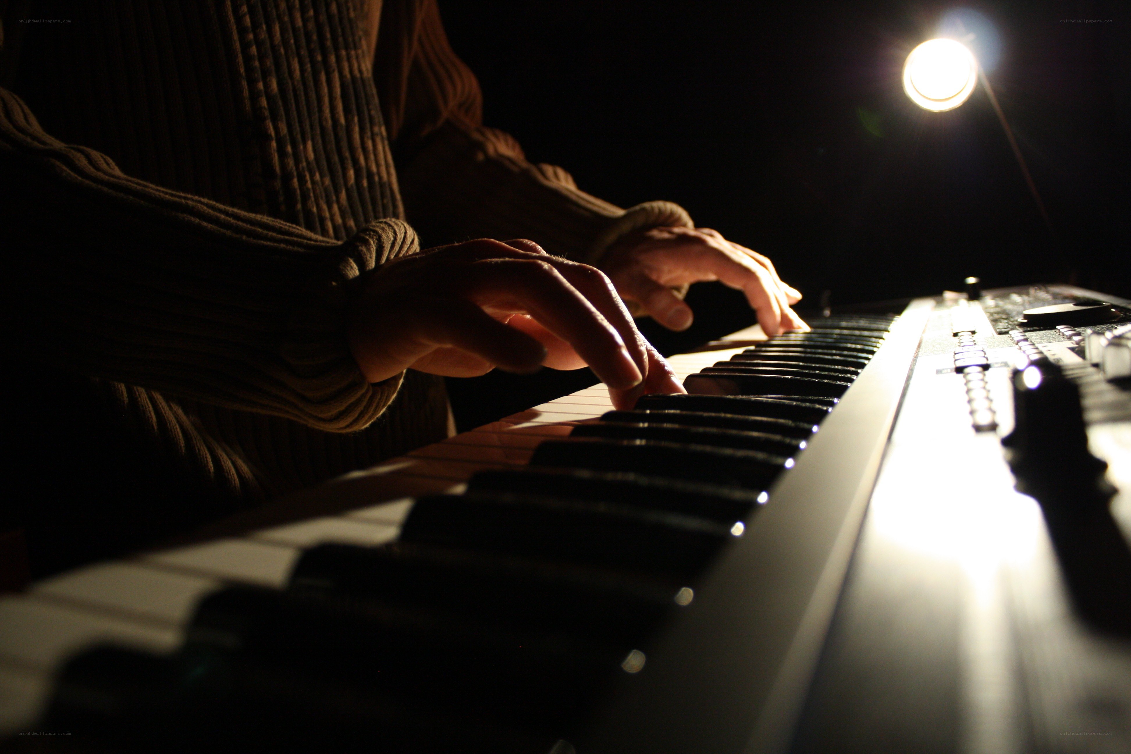 person playing keyboard instrument