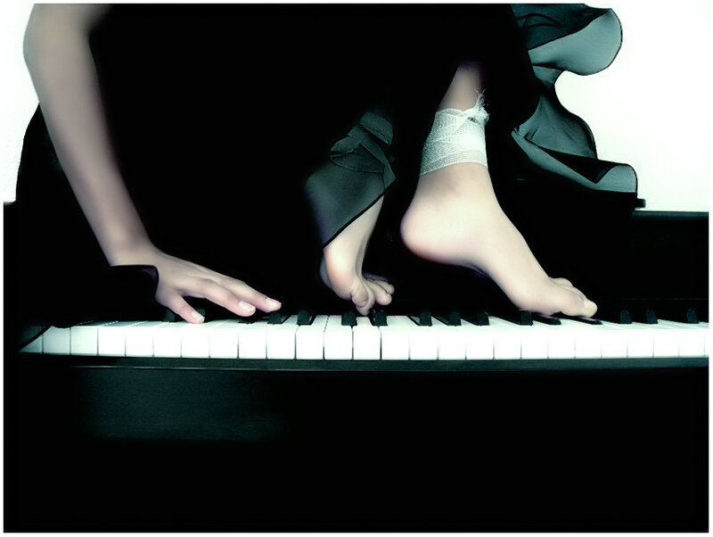 person playing piano barefoot