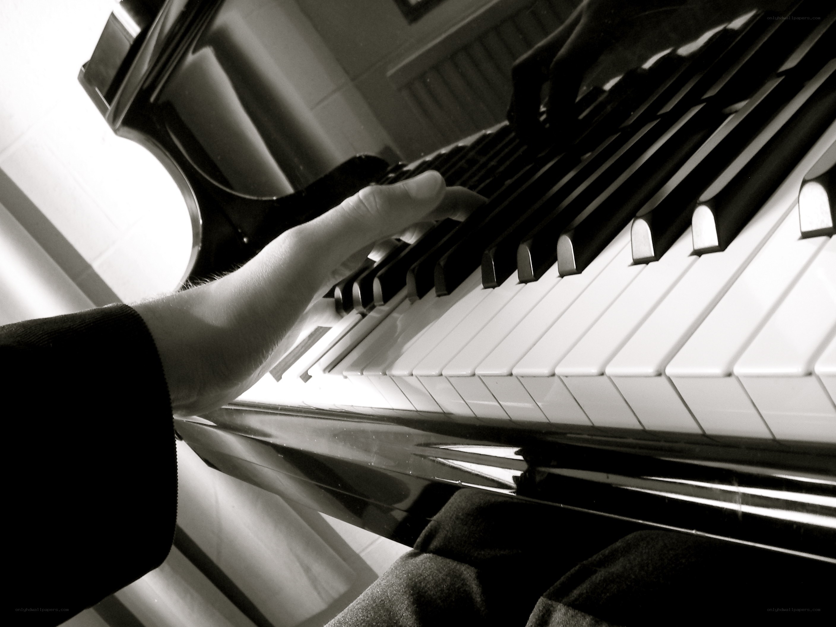 person playing piano keys