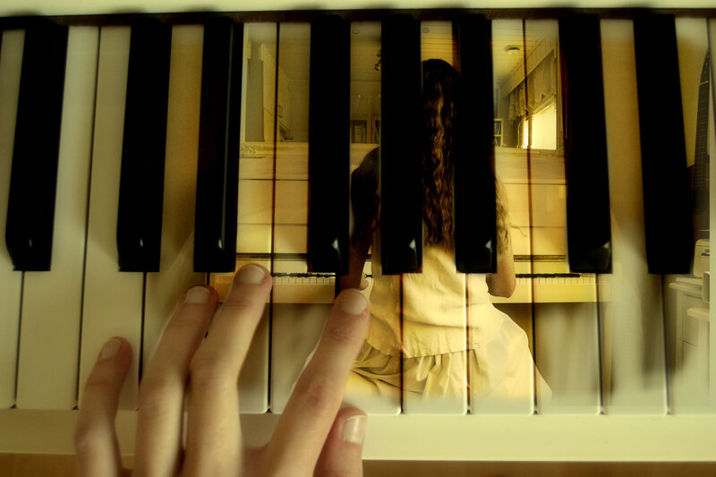 Person Playing Piano — Yellow