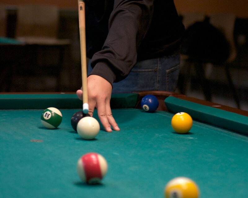 Person Playing Pool — Green