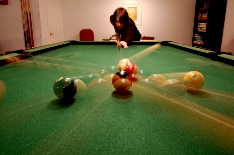 Person Playing Pool