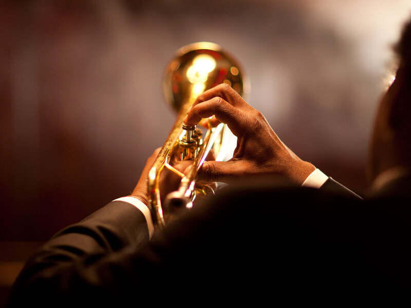 Person Playing Trumpet — Gold, Dramatic