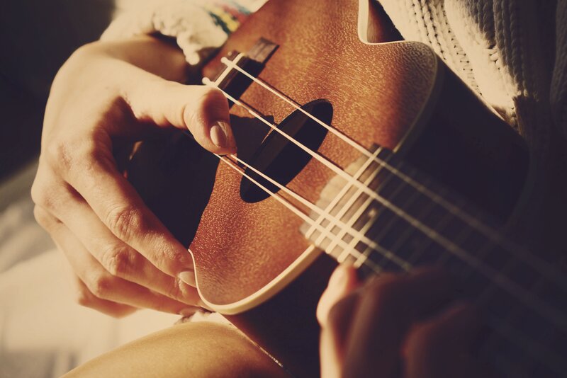 person playing ukulele