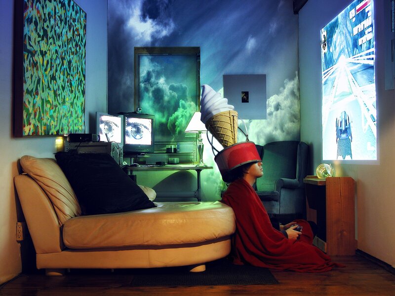 person playing video game in surreal room