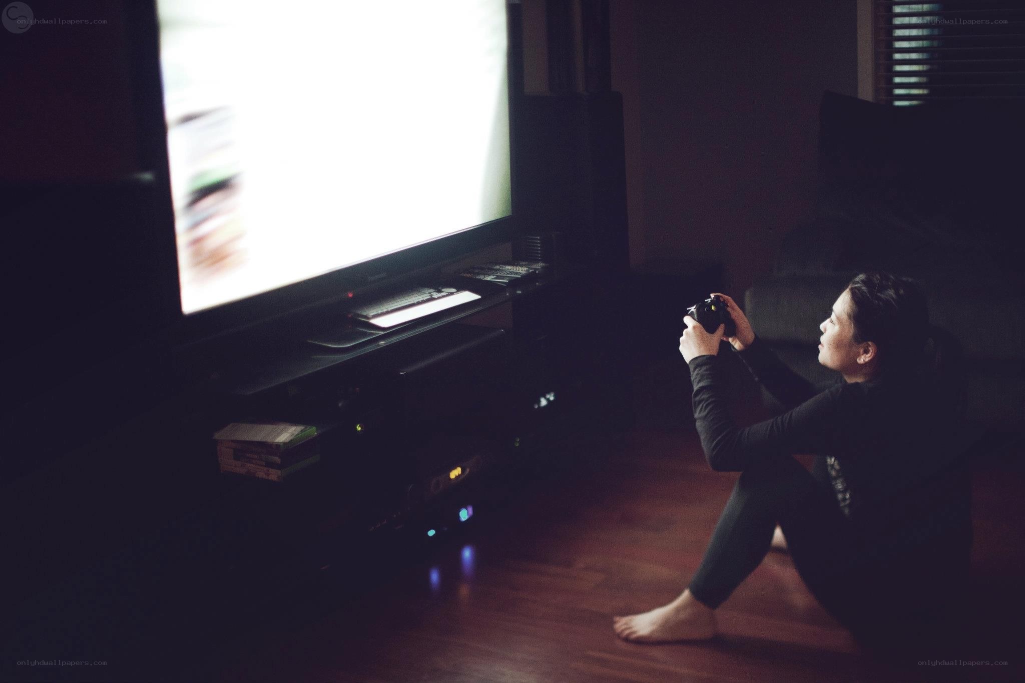 person playing video game on floor