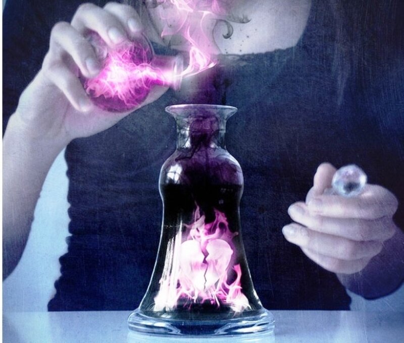 person pouring glowing liquid