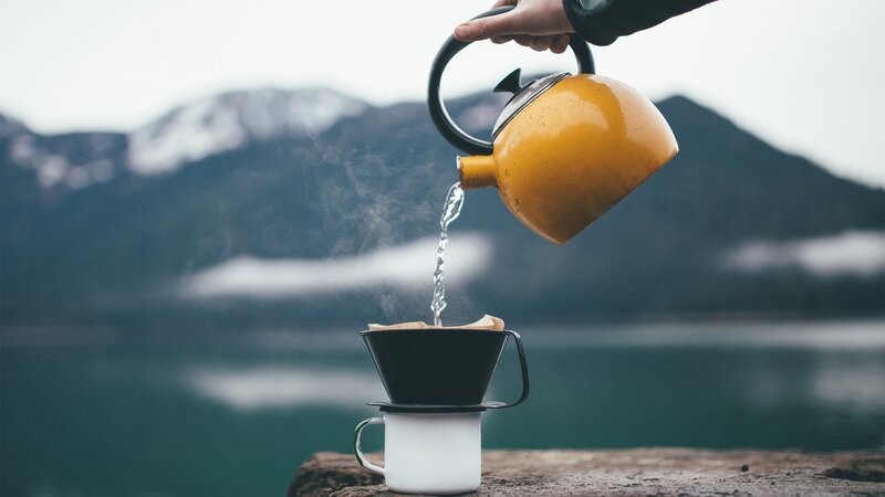 Person Pouring Tea — Yellow