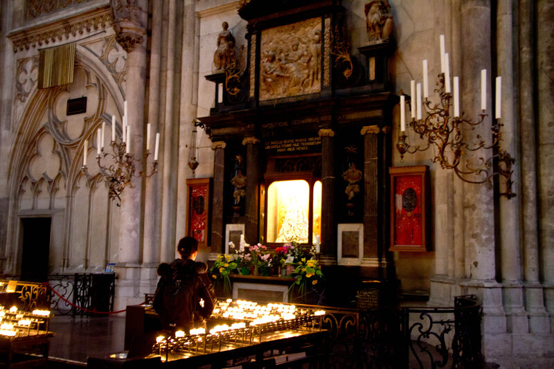 Person Praying at Altar