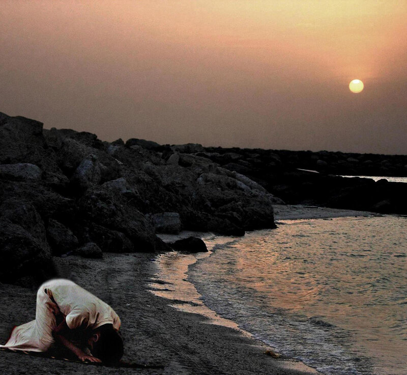 Person Praying on Beach