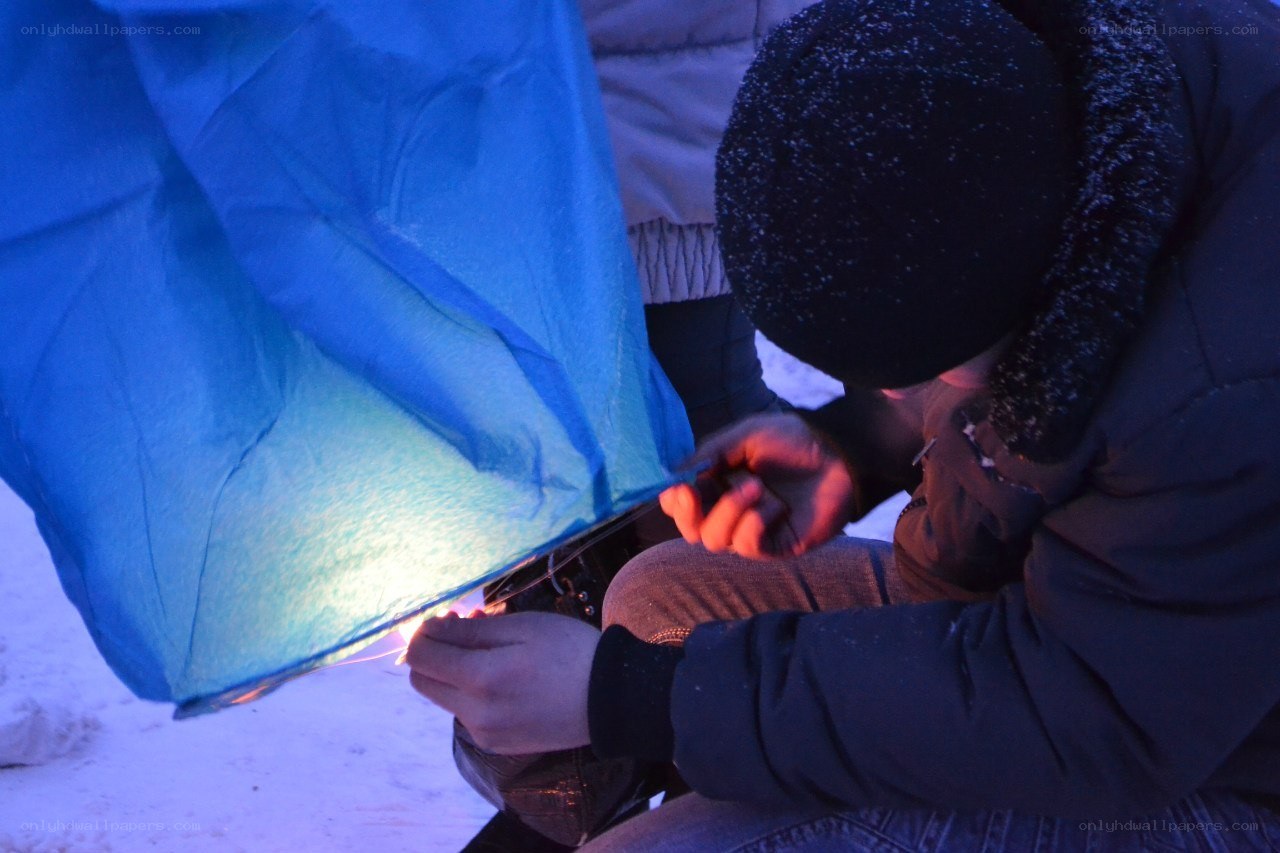 Person preparing a sky lantern
