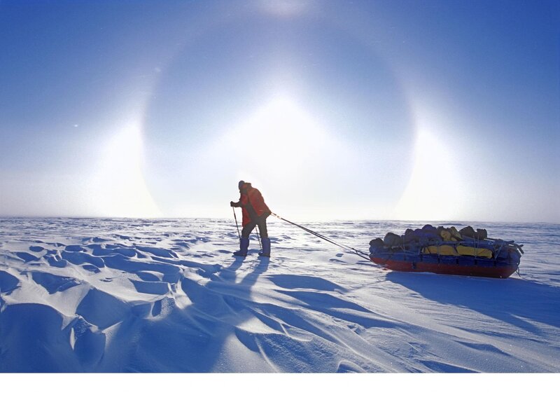 Person Pulling Sled — Blue