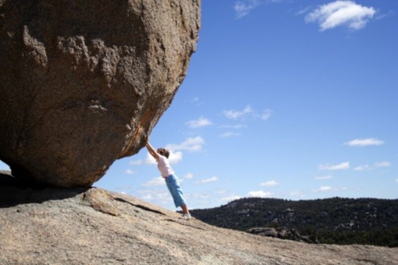Person Pushing Boulder