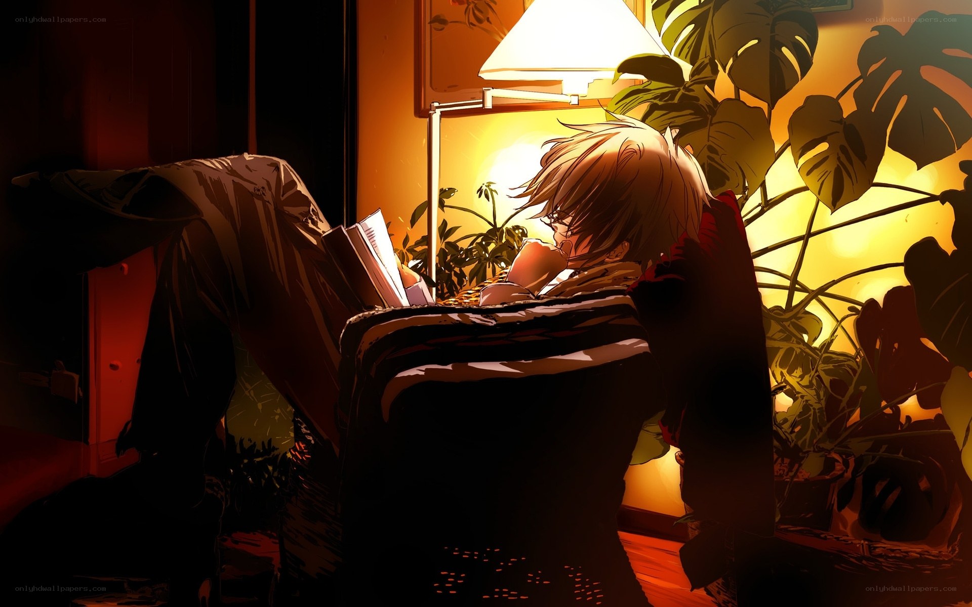 person reading in armchair