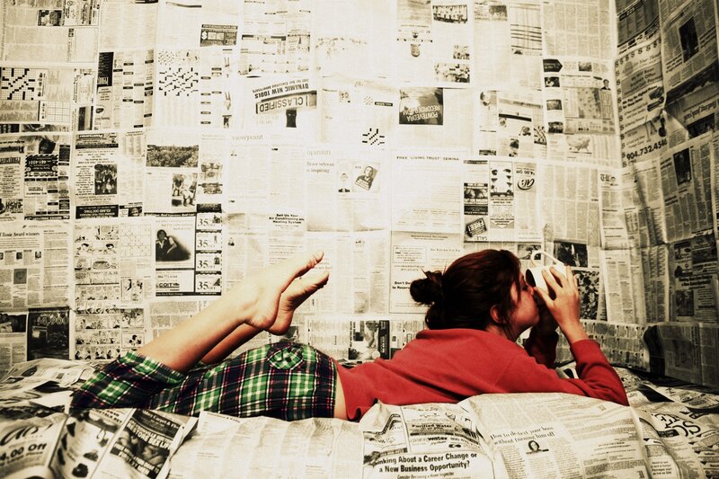 Person Reading Newspapers